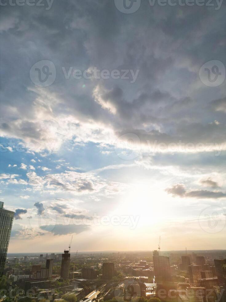 Iconic Buildings at Central Greater Manchester City Centre and Tall Buildings During Golden Hour of Sunset over England UK. Aerial Footage Was Captured with Drone's Camera on May 5th, 2024. photo
