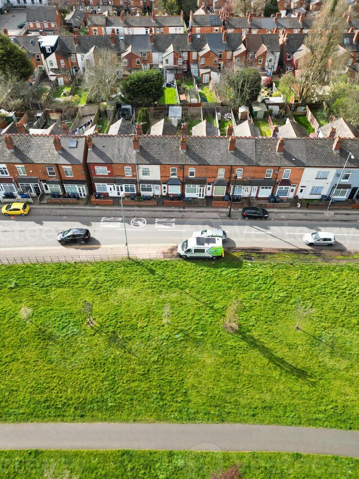 Aerial View of Residential District at Birmingham City of Midlands, England, United Kingdom. Drone Camera Footage was Captured from High Altitude During Sunset Time of March 30th, 2024. photo
