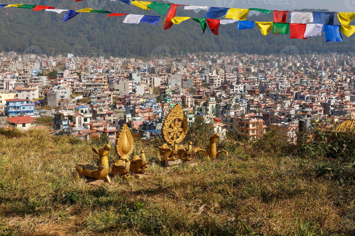 Buddhist symbols on a hill against the background of the city of Kathmandu, Nagarjun Nepal. photo