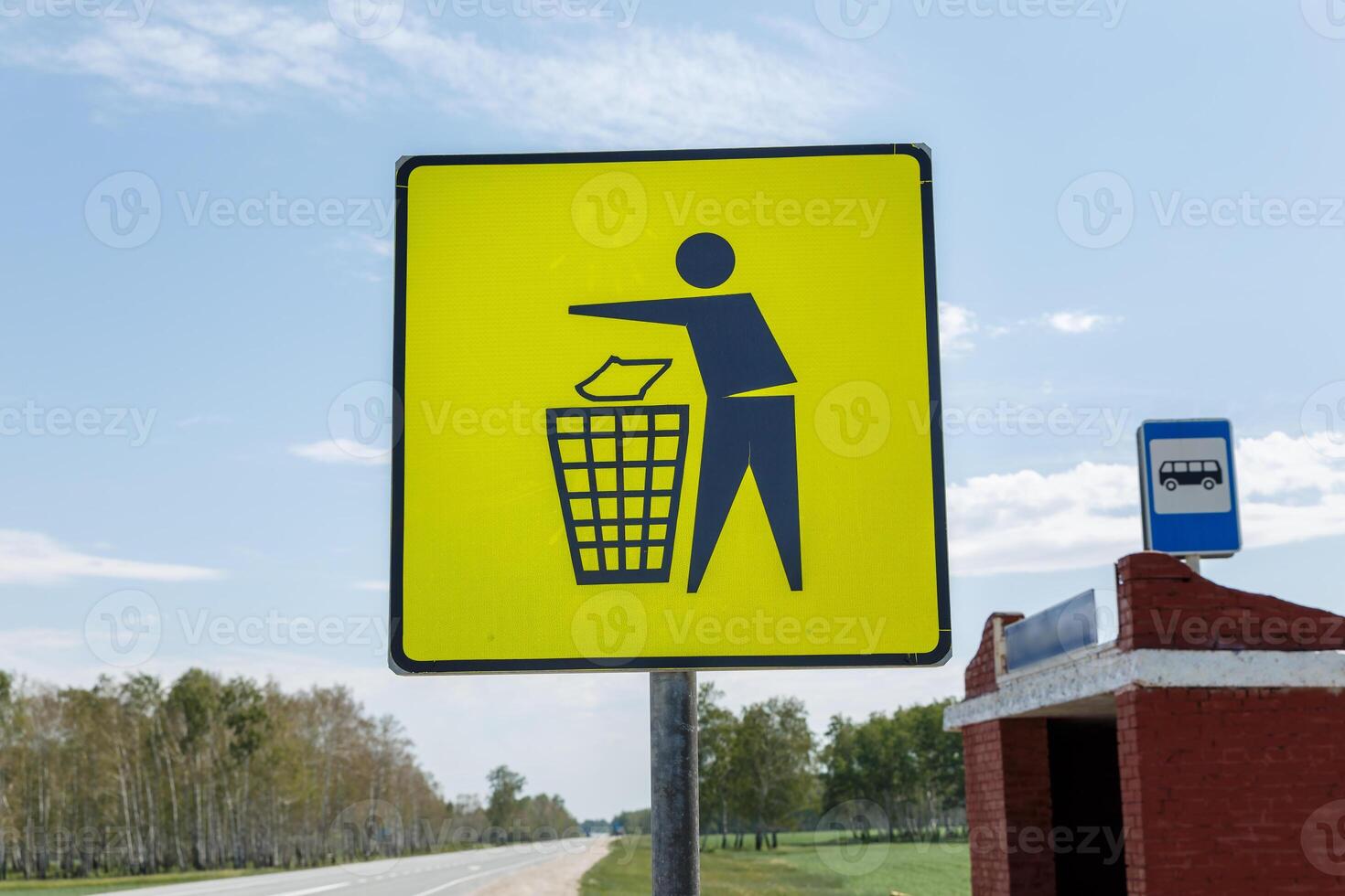 Garbage disposal. Yellow trash can sign at the bus stop. Trash icon sign on yellow label, road signs photo