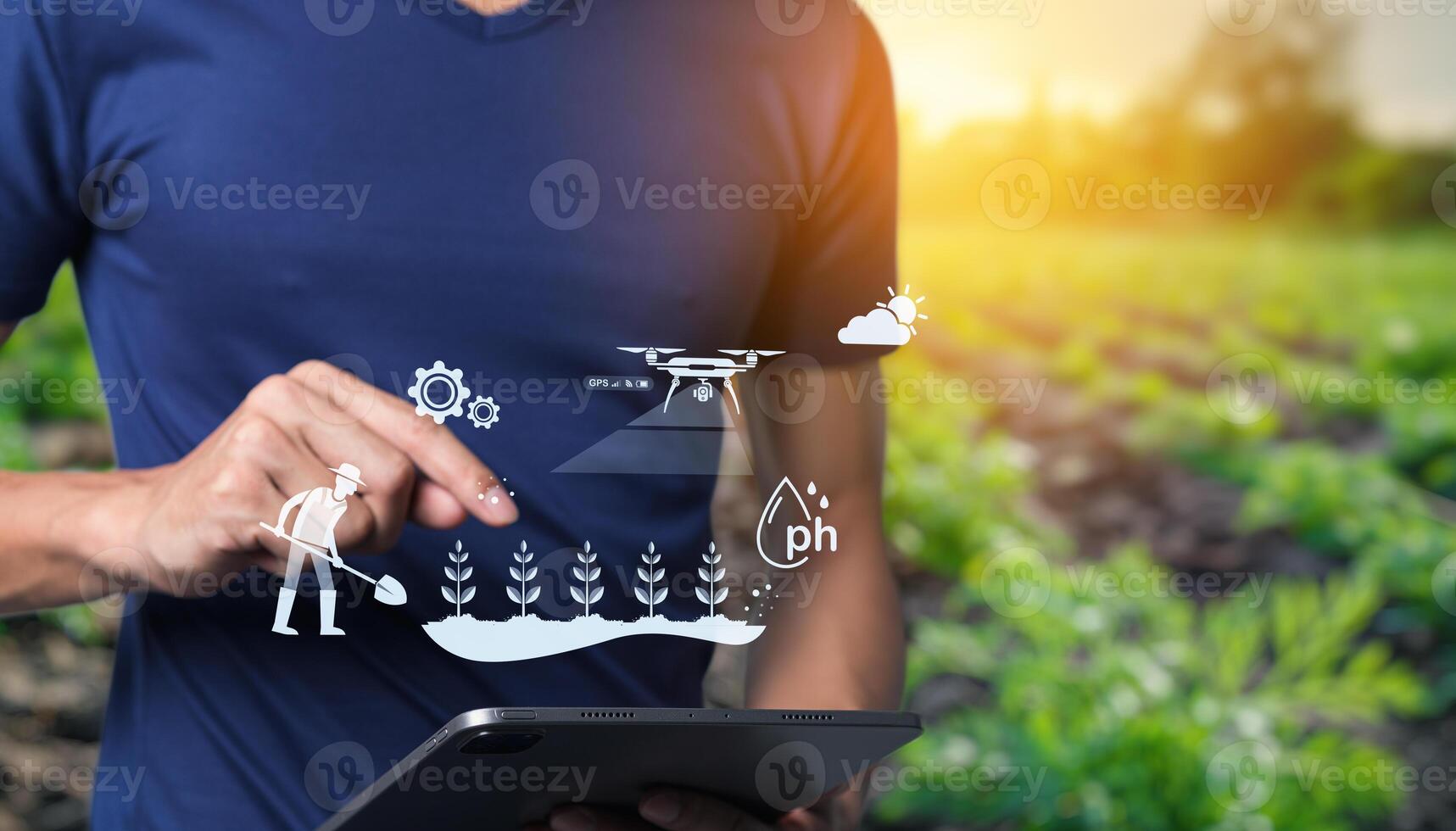 Man using tablet to control drone in field photo