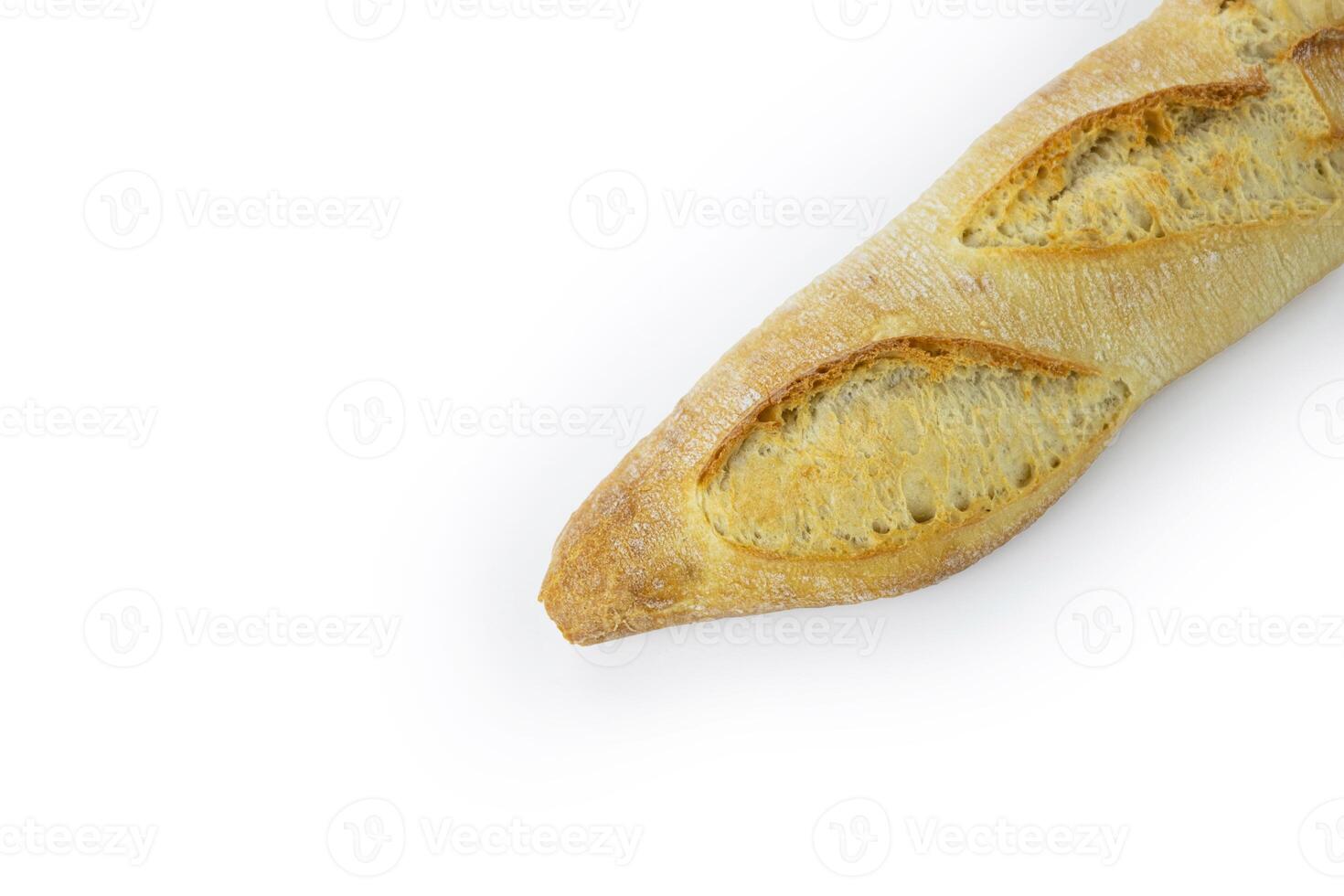 Freshly baked French baguette with a crispy golden crust. Ideal for breakfast and dinner. Traditional homemade white bread. Isolated on a white background. Closeup. With clipping path photo