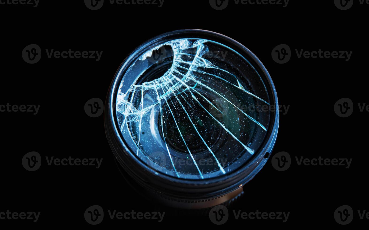 Closeup of a broken shattered camera lens with cracks, symbolizing damage and fragility of photography equipment, repair or replacement needs. Isolated on black background. Copy space photo