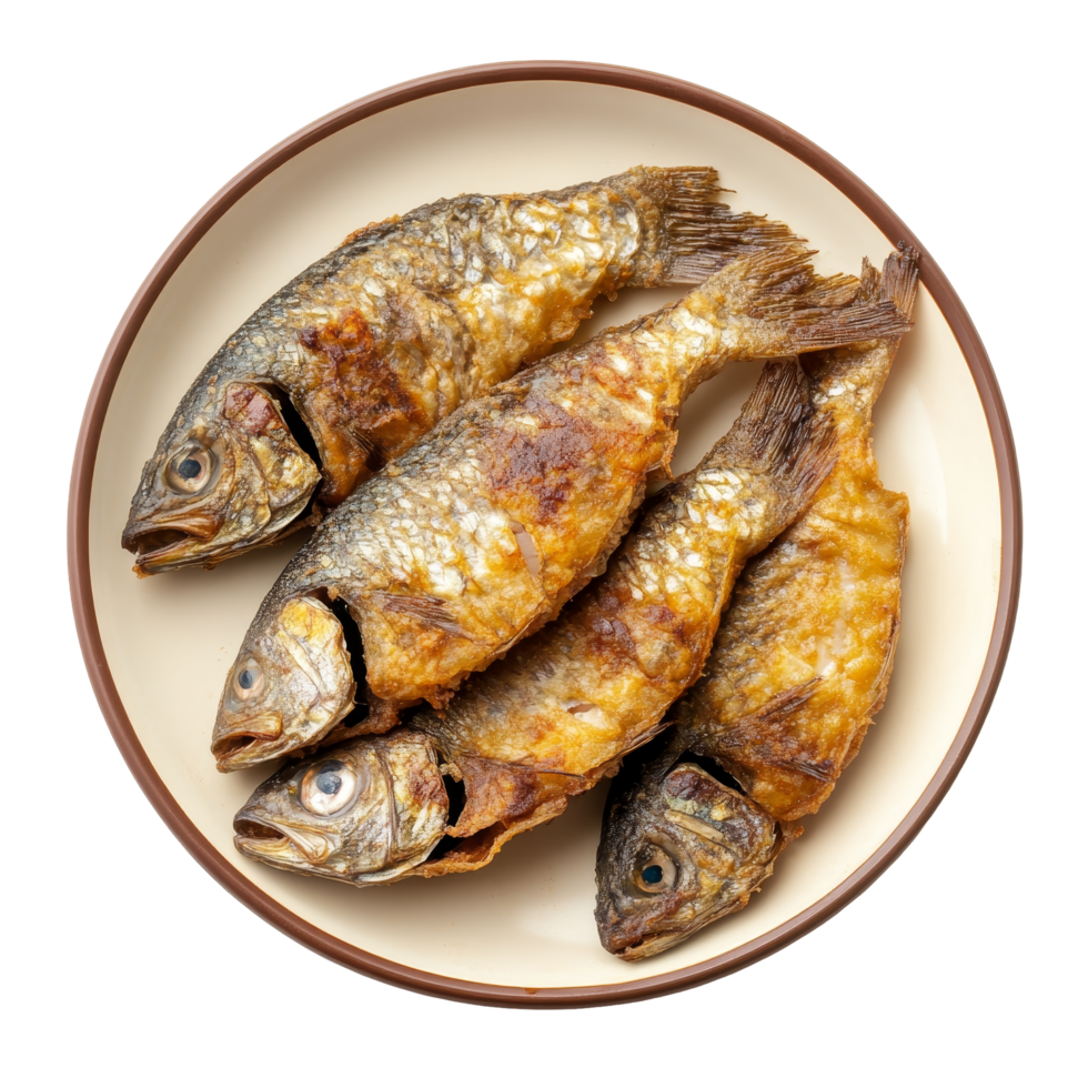 Deliciously fried small fish served on a plate against a clean transparent background, small fried fish in plate on transparent background png