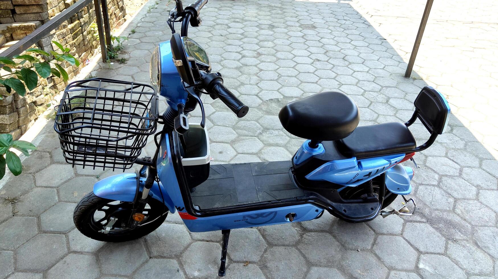 Demak, Indonesia October 26 2024, blue electric bicycle. green transportation sign and symbol. photo