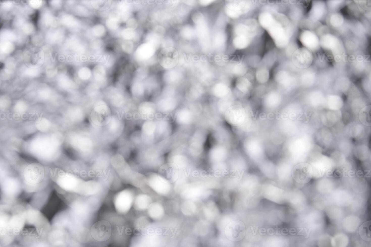 Abstract silver bokeh background with blurred light and soft focus. photo