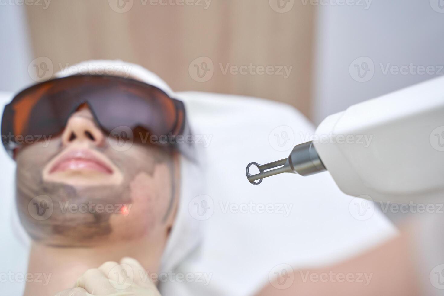Advanced laser skin treatment in professional clinic for rejuvenation and clear complexion with safety precautions. photo