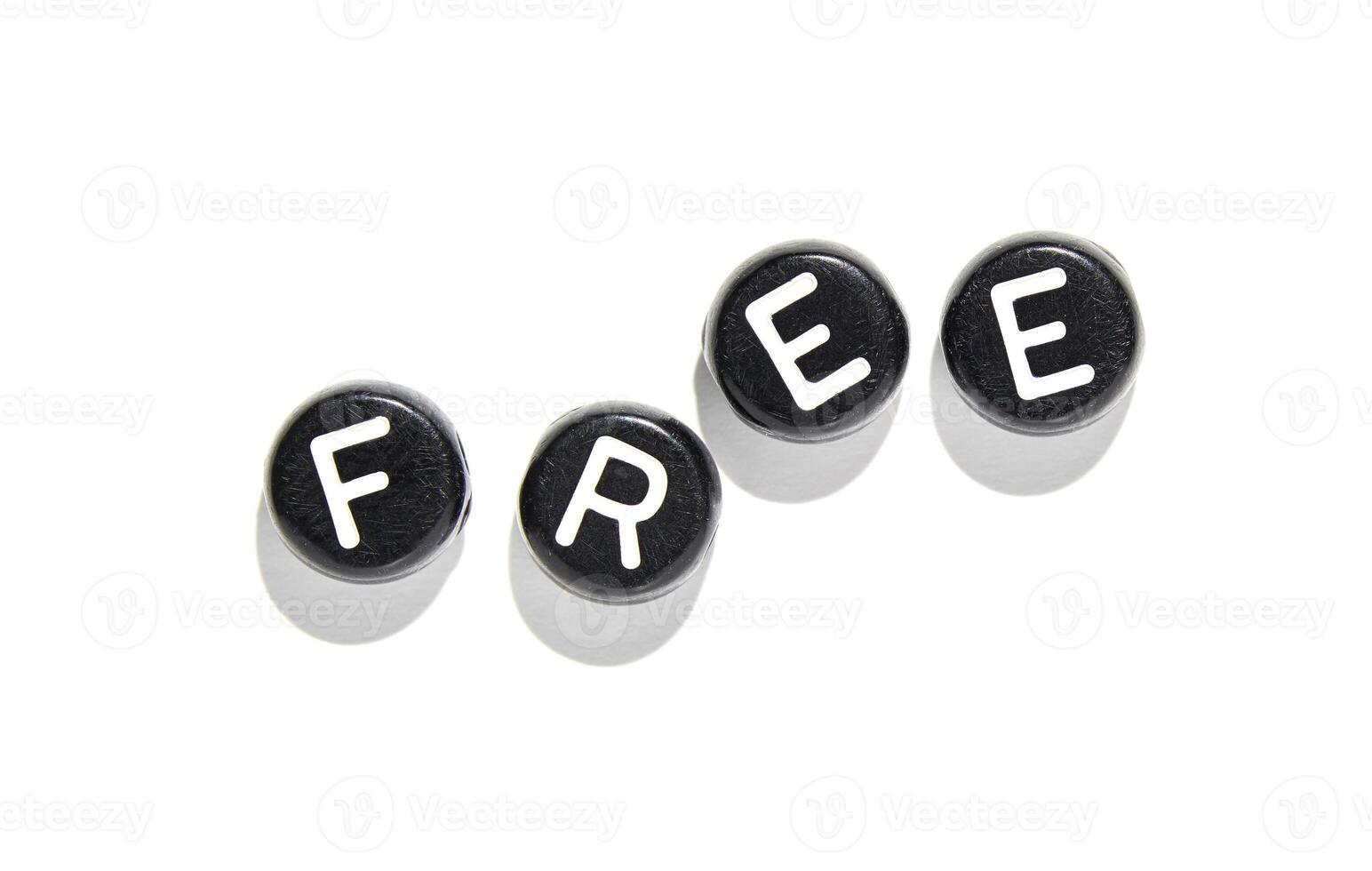 Black keyboard keys spelling free with shadows on white background symbolizing freedom and creativity photo