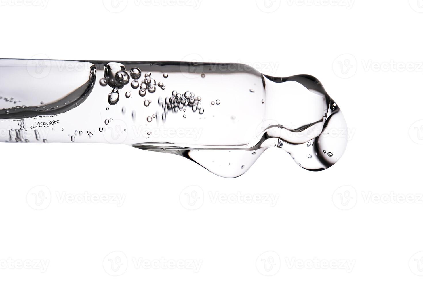 Dropper pipette with delicious serum with bubbles close-up. photo
