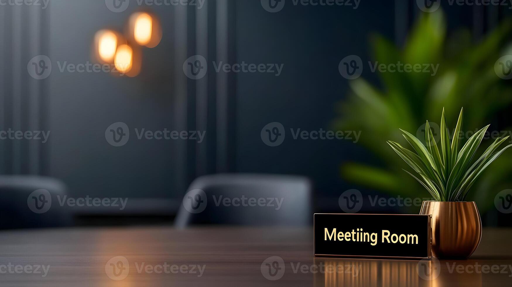 Meeting Room sign on office glass wall with empty collaboration workspace, large table, and armchairs in background. photo