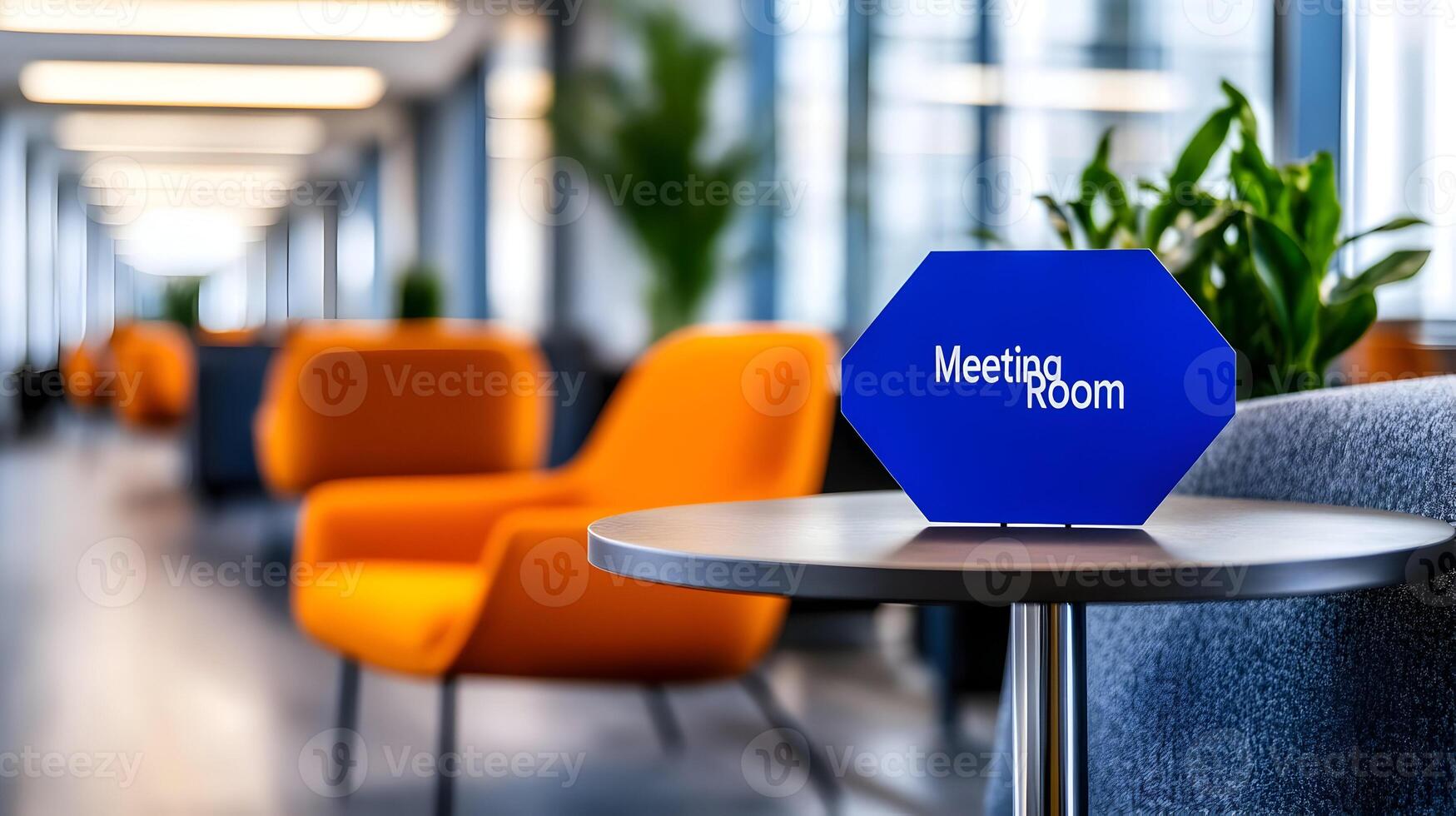 Meeting Room sign on office glass wall with empty collaboration workspace, large table, and armchairs in background. photo