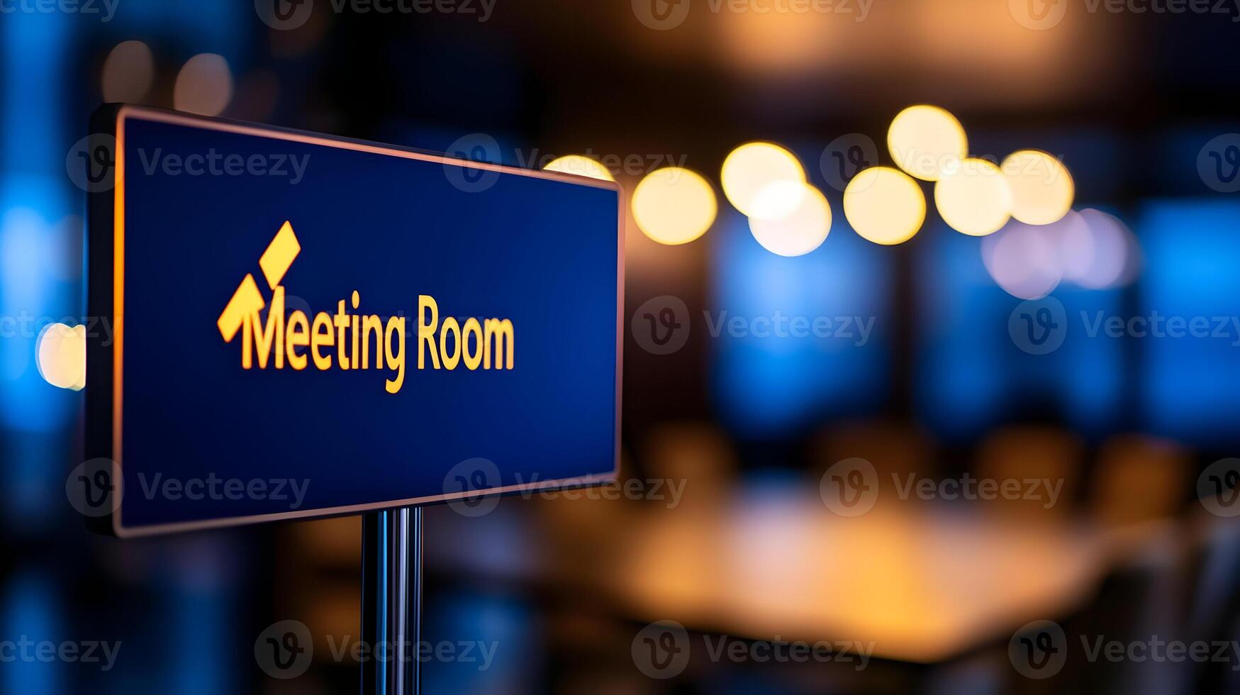 Meeting Room sign on office glass wall with empty collaboration workspace, large table, and armchairs in background. photo