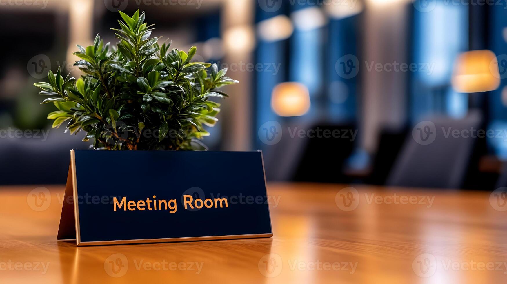Meeting Room sign on office glass wall with empty collaboration workspace, large table, and armchairs in background. photo