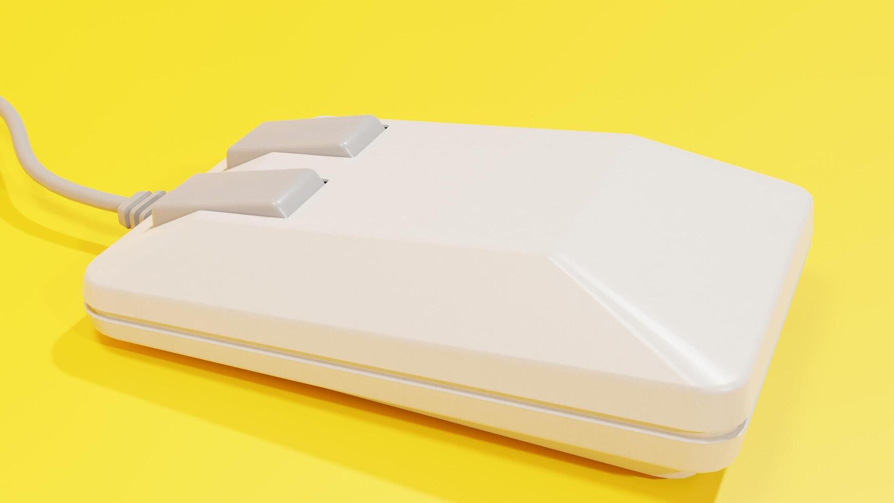 A white computer mouse on a yellow background photo