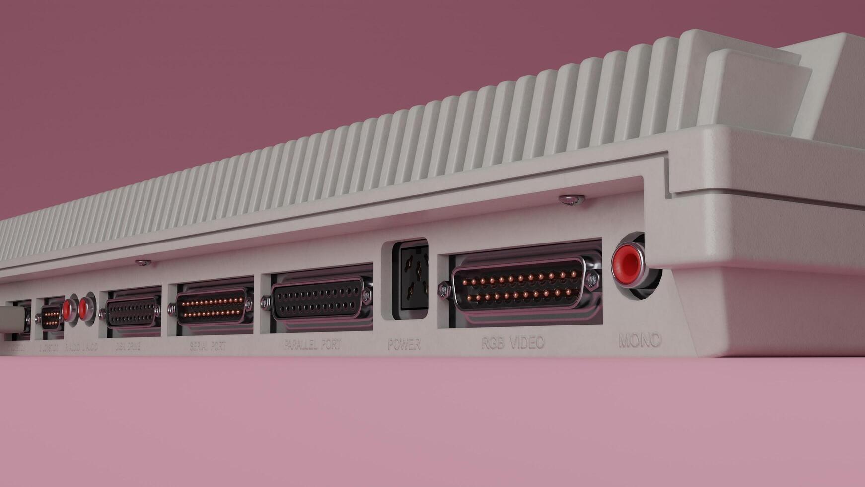 A close up of a white computer with a red and black cable photo