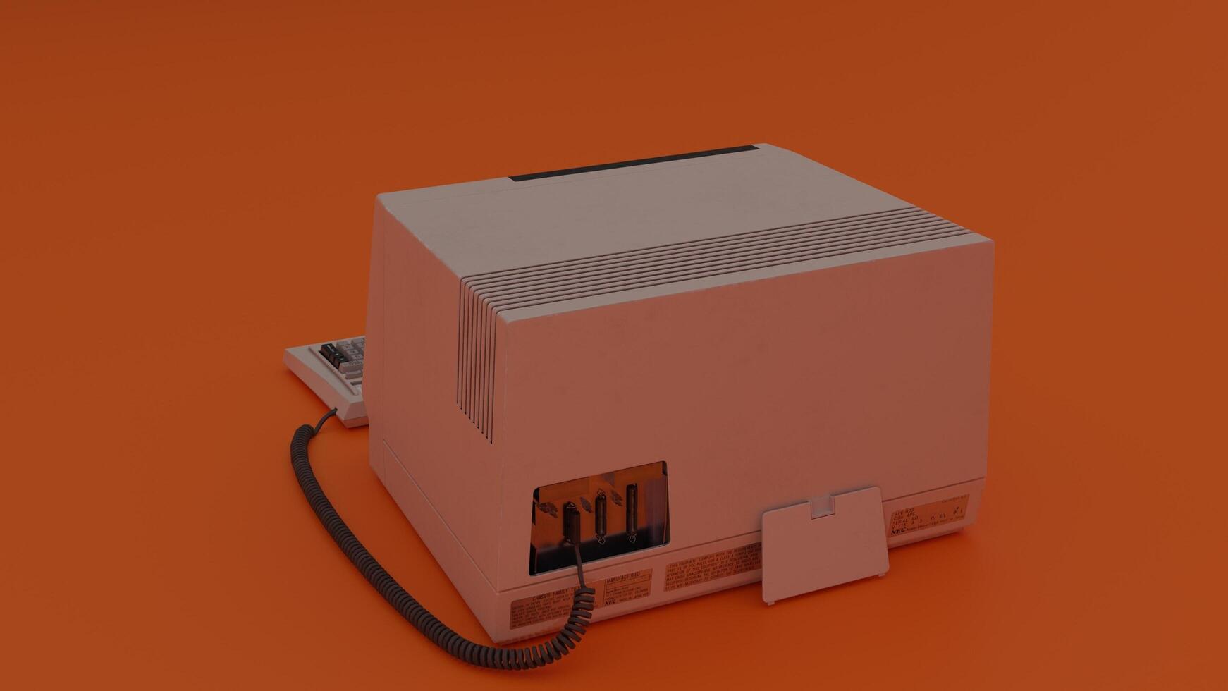 A white computer with a cord connected to it photo