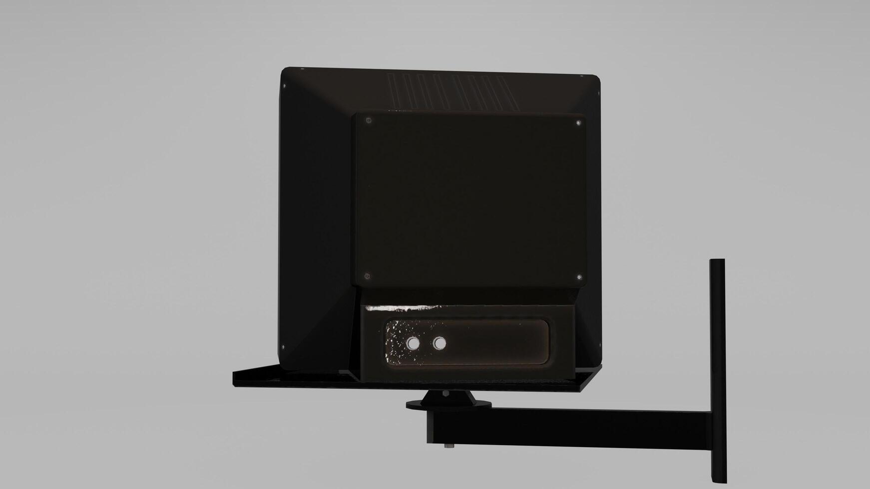 A black wall mounted television with a remote control photo