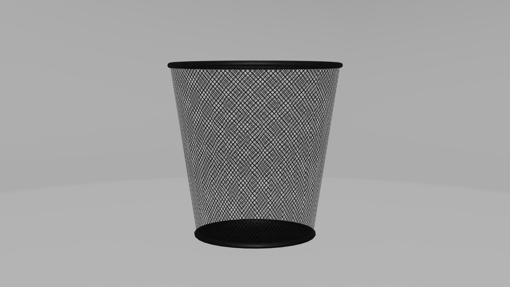 A black trash can with mesh netting on it photo