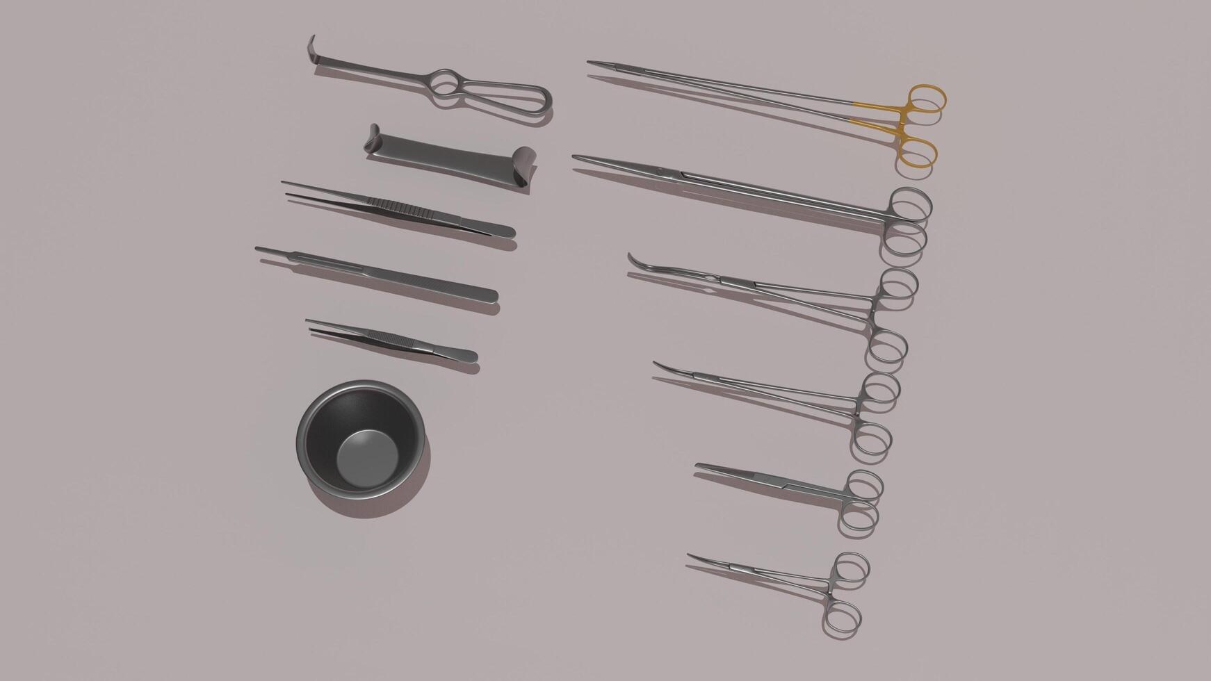 A set of surgical instruments on a gray surface photo