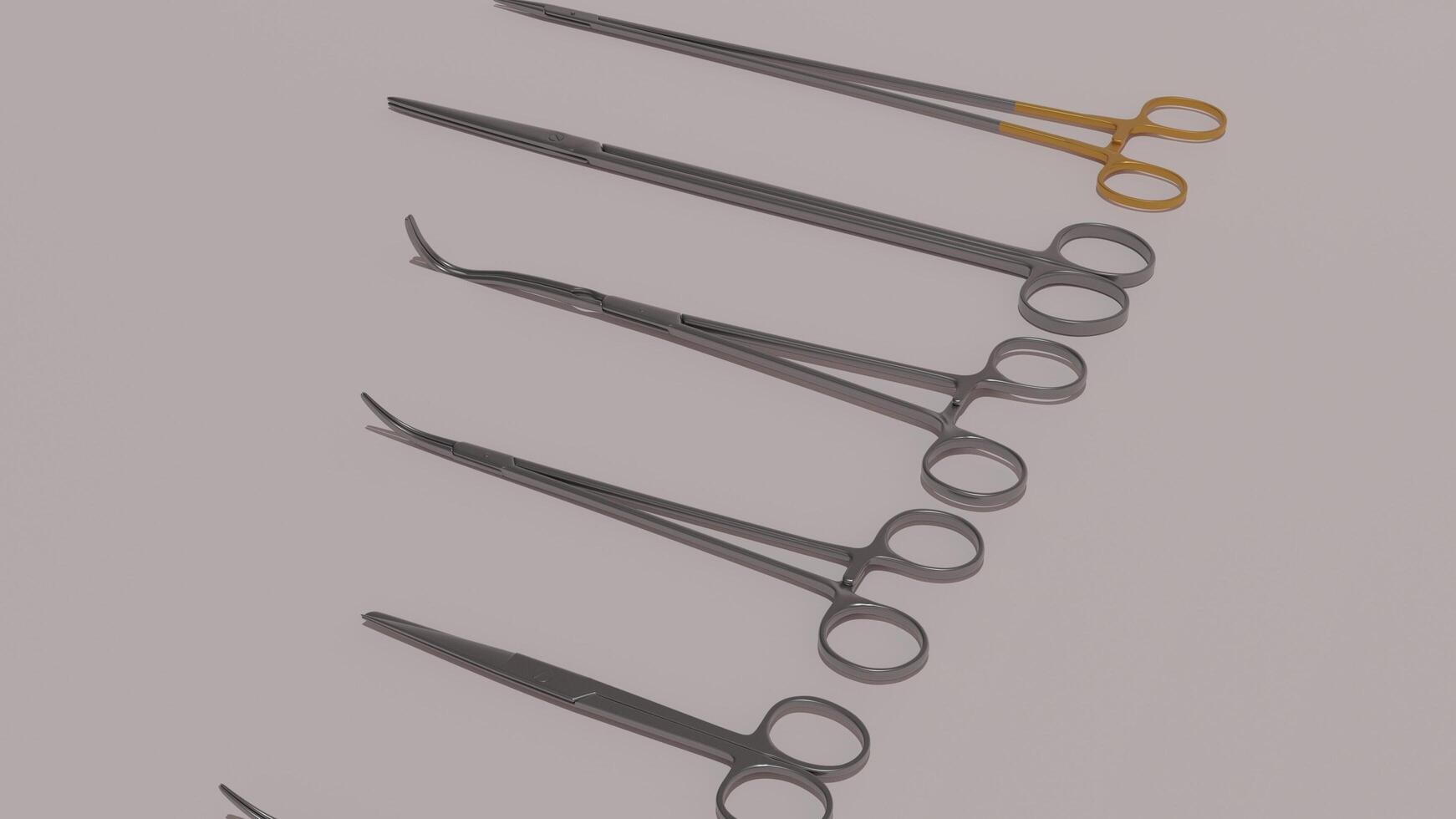 A set of surgical instruments on a gray background photo