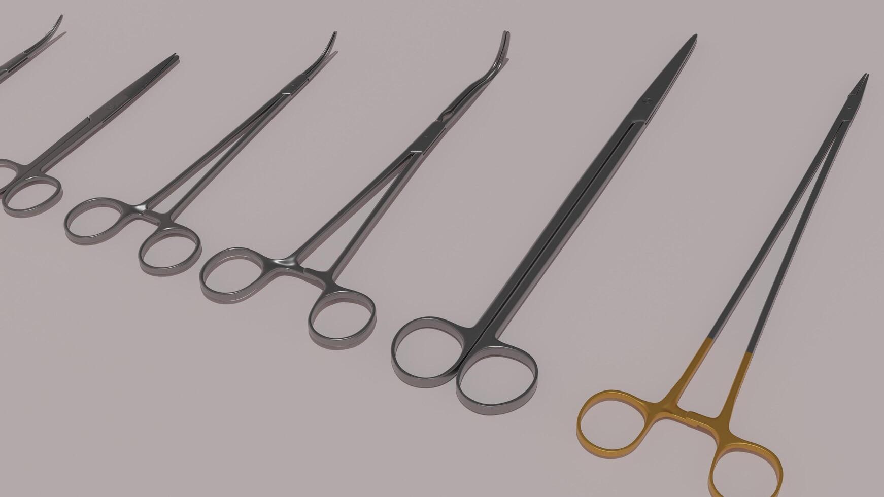 A set of surgical instruments are shown on a gray background photo