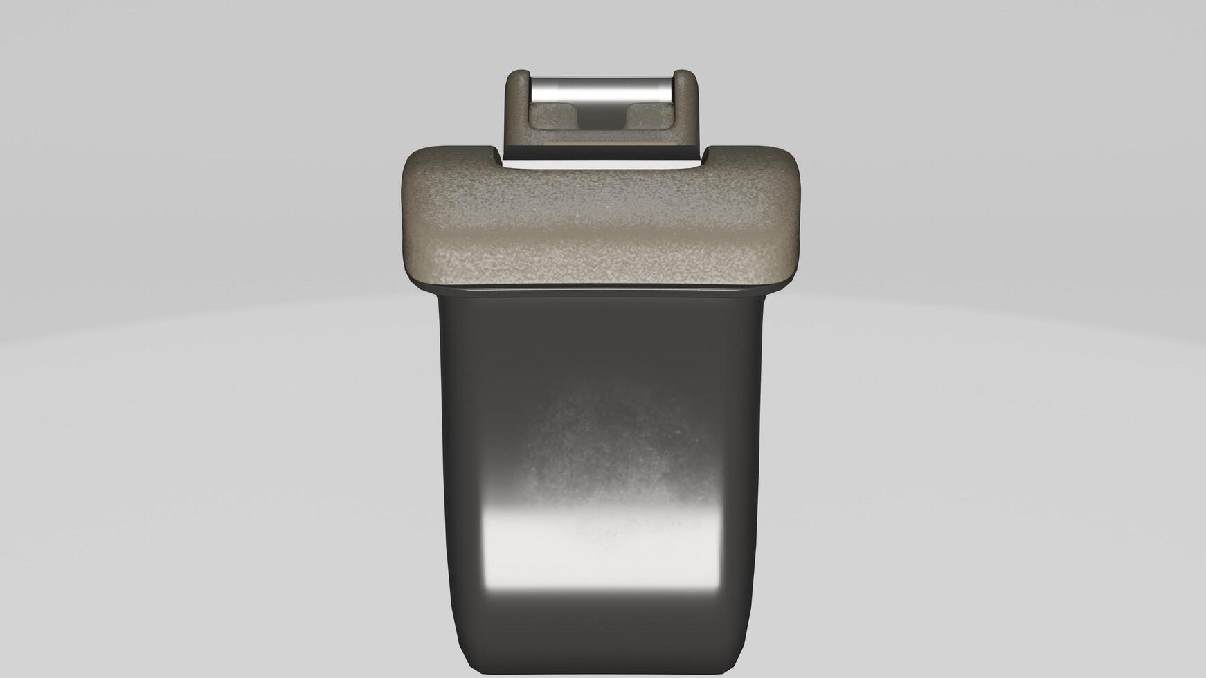 A black and silver object with a small button photo