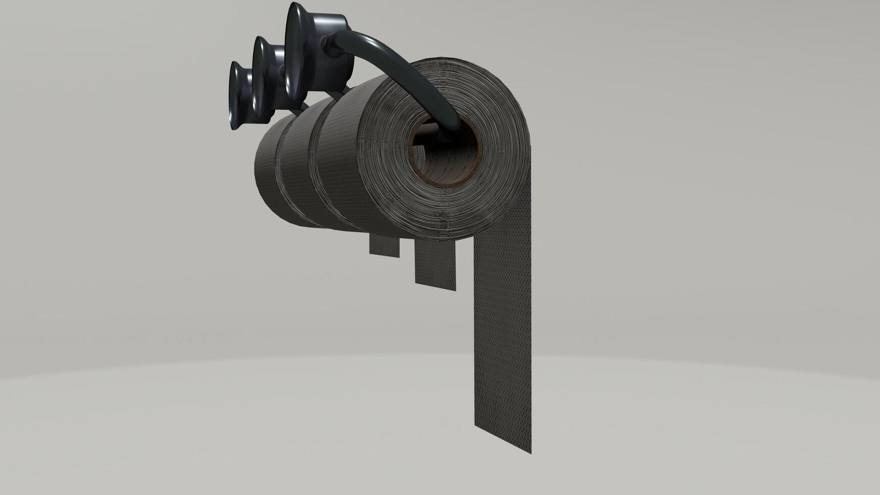 A roll of black toilet paper is hanging on a wall photo