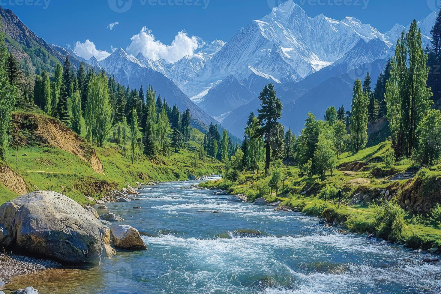 A Serene Mountain River Flowing Through Lush Green Valley photo