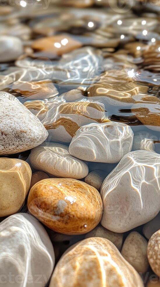 Smooth River Rocks Submerged in Sparkling Water photo