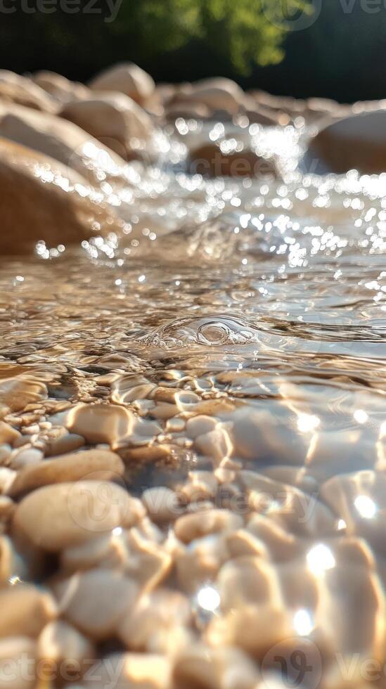 Sunlit Ripples on a Stream Bed with Pebbles photo