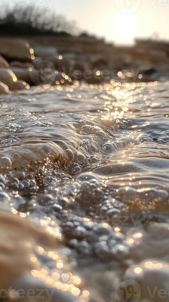 Close-up of Sparkling Water with Air Bubbles and Sun Glare photo