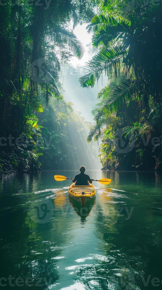 Kayaking Through a Lush Tropical Rainforest Canyon photo