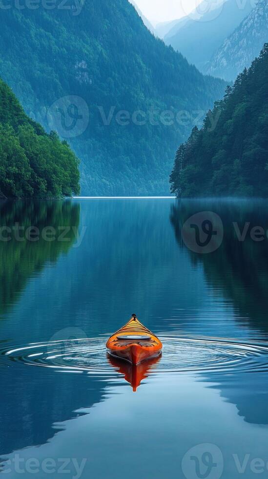 Solo Kayak on a Tranquil Mountain Lake photo