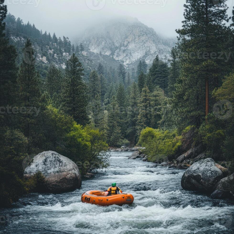 A Solo Rafter Navigates Through Rapids in a Mountainous Forest photo