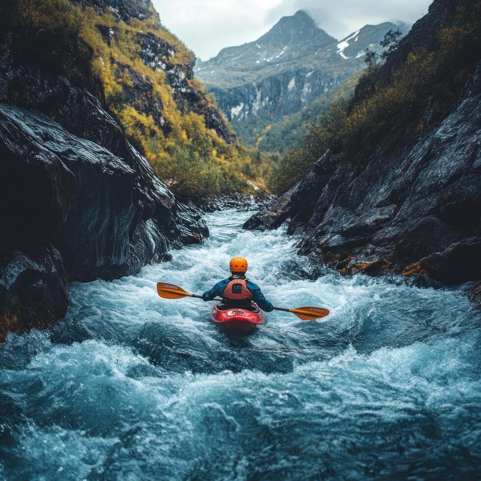 Kayaker Navigating a Mountain River Gorge photo