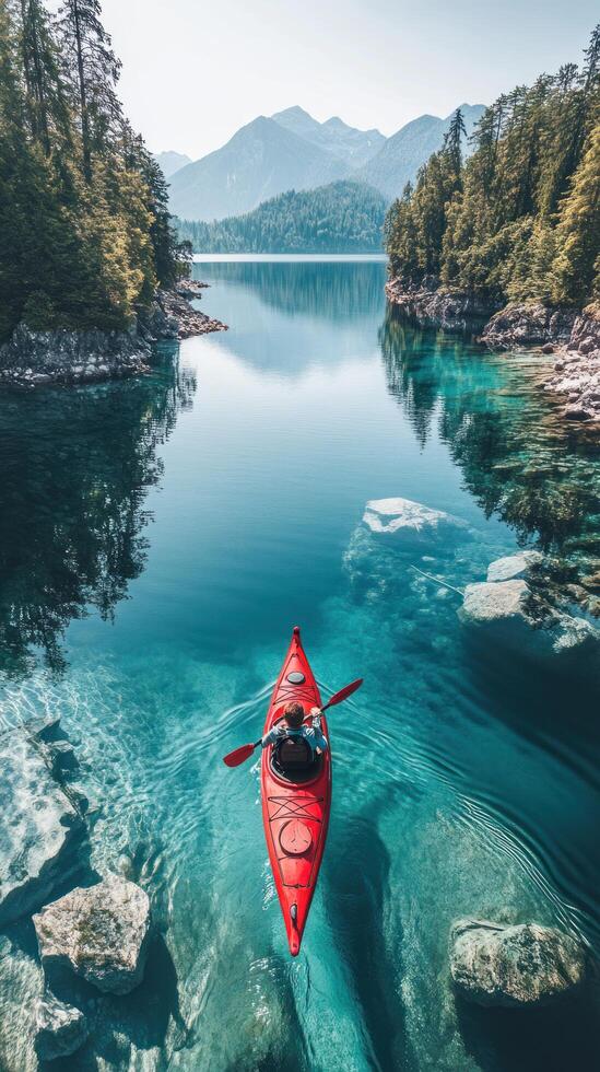 Solo Kayaking Through a Mountain Lake Inlet photo