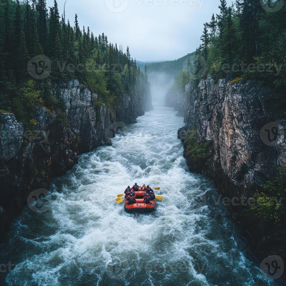 A group of people rafting down a river through a foggy canyon photo