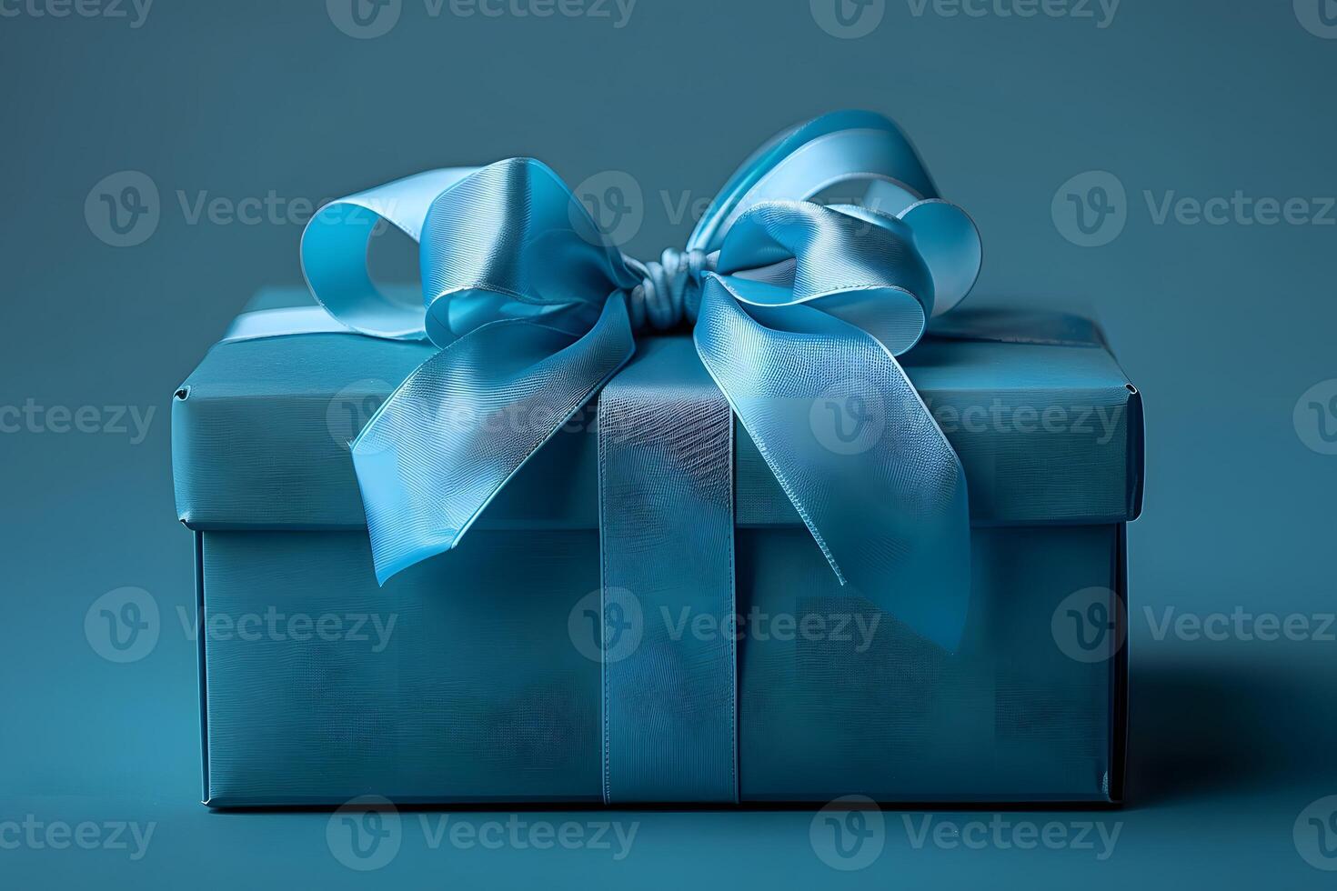 Elegant Blue Gift Box with Ribbon for Celebrations and Special Occasions photo