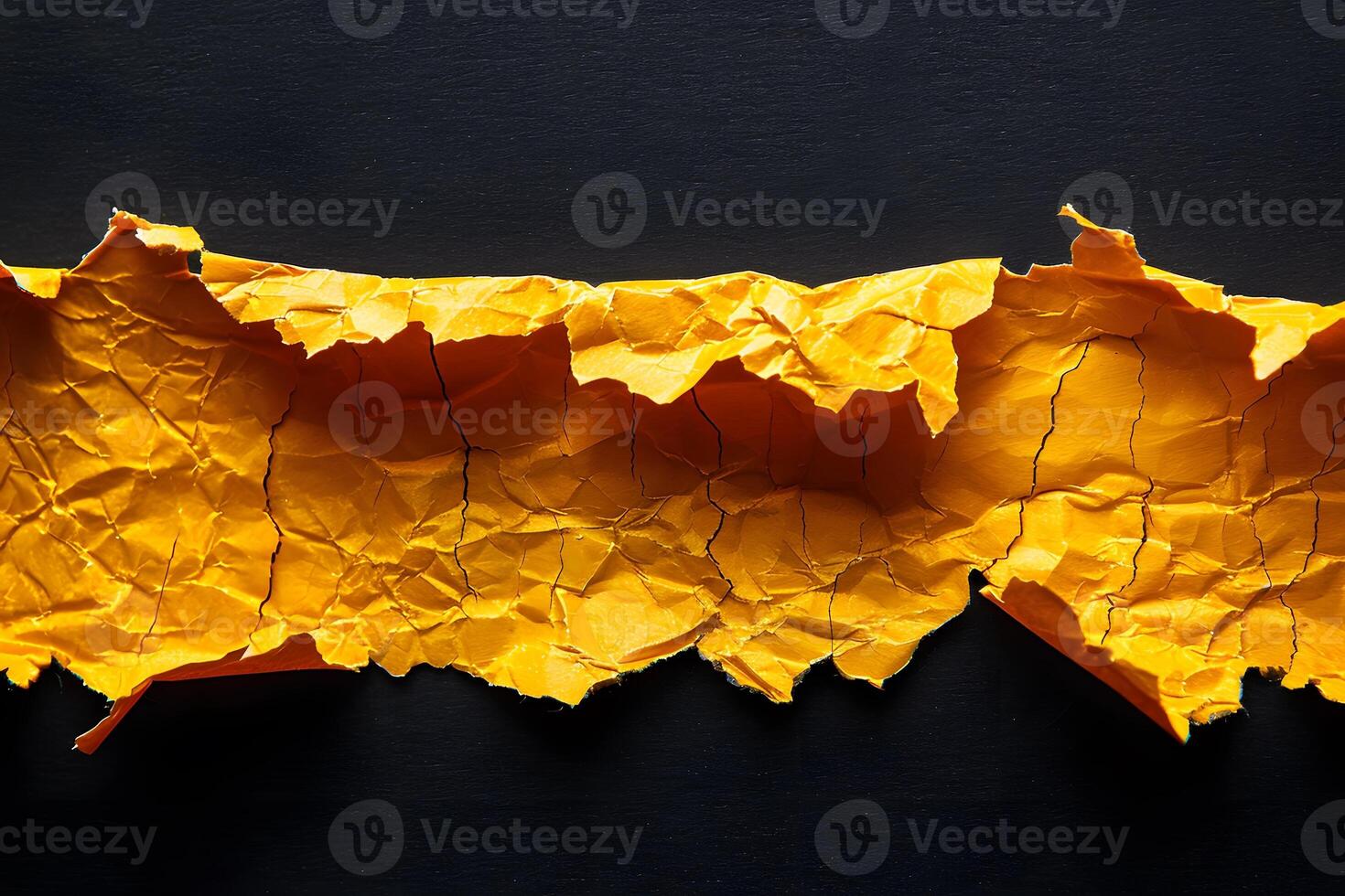 Vibrant Yellow Torn Paper Texture on Black Background for Design Projects photo