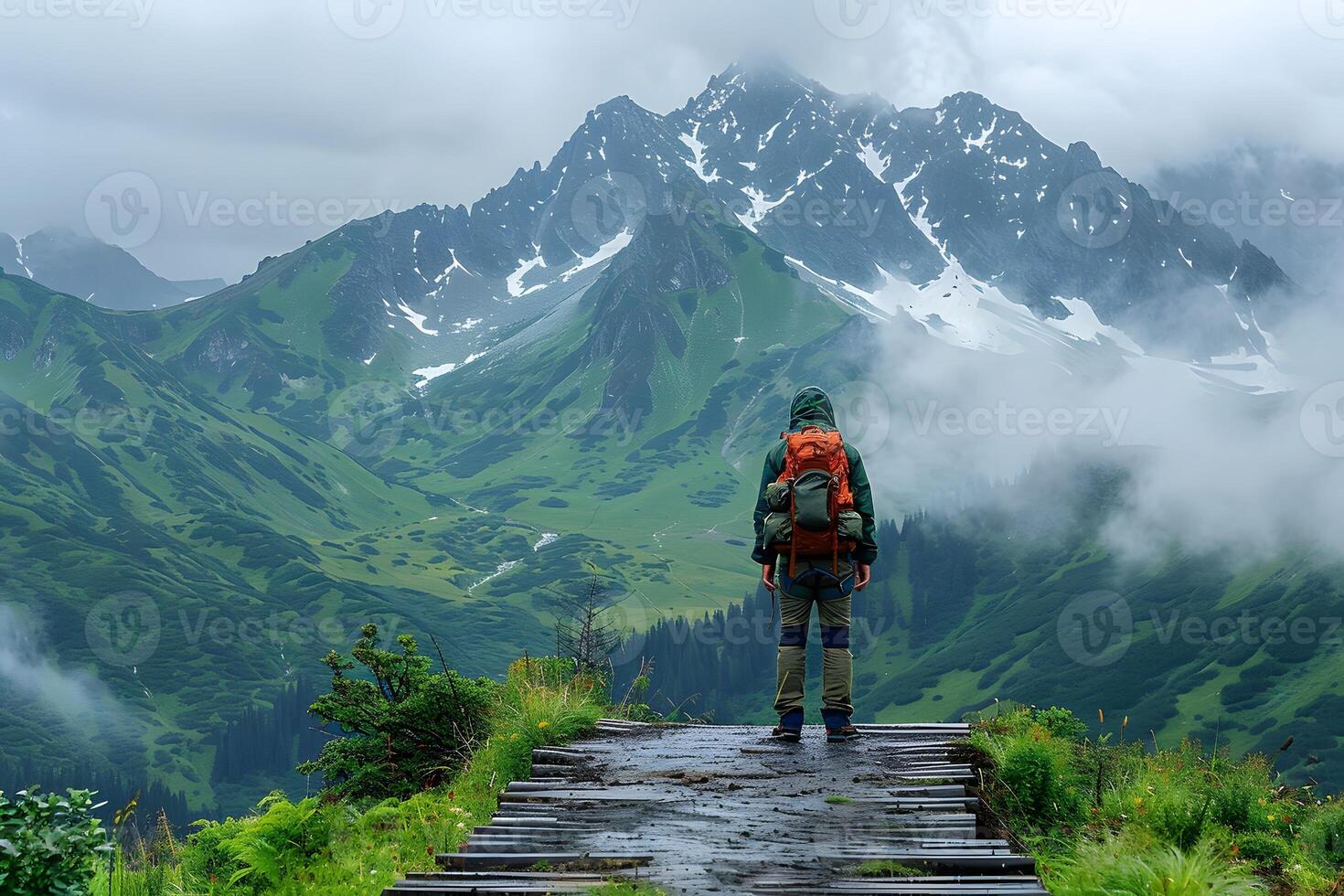 Adventurous Hiker Exploring Misty Mountain Path on a Cloudy Day photo