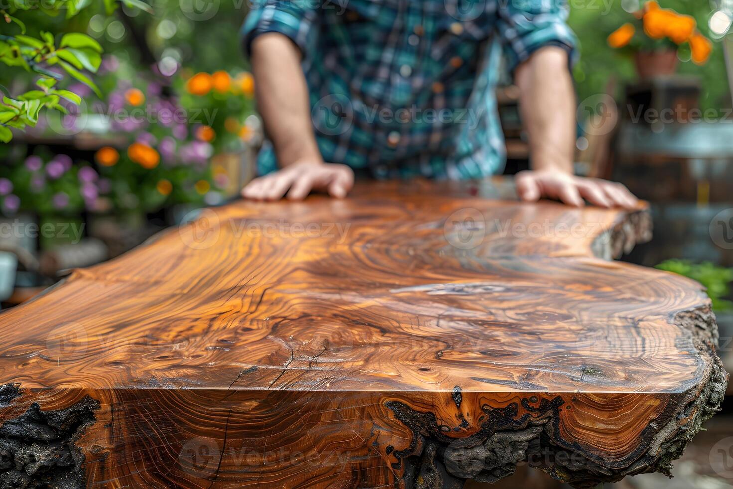 Craftsman Working with Rustic Live Edge Wood Table in Outdoor Workshop photo