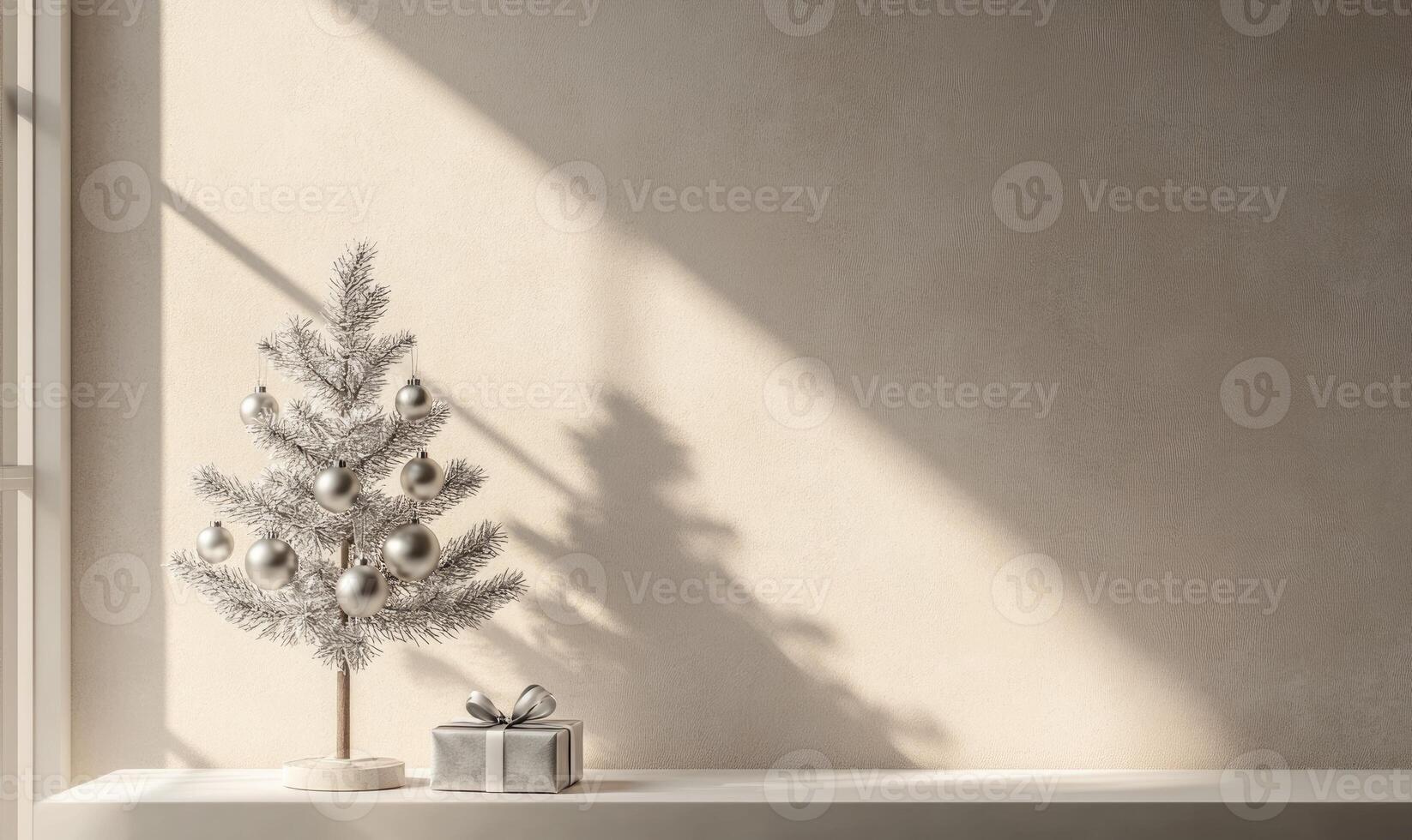 A silver christmas tree with a silver box on a shelf photo