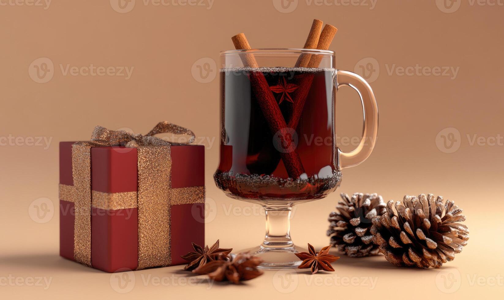 A glass of mulled wine sits on a table next to a red box photo