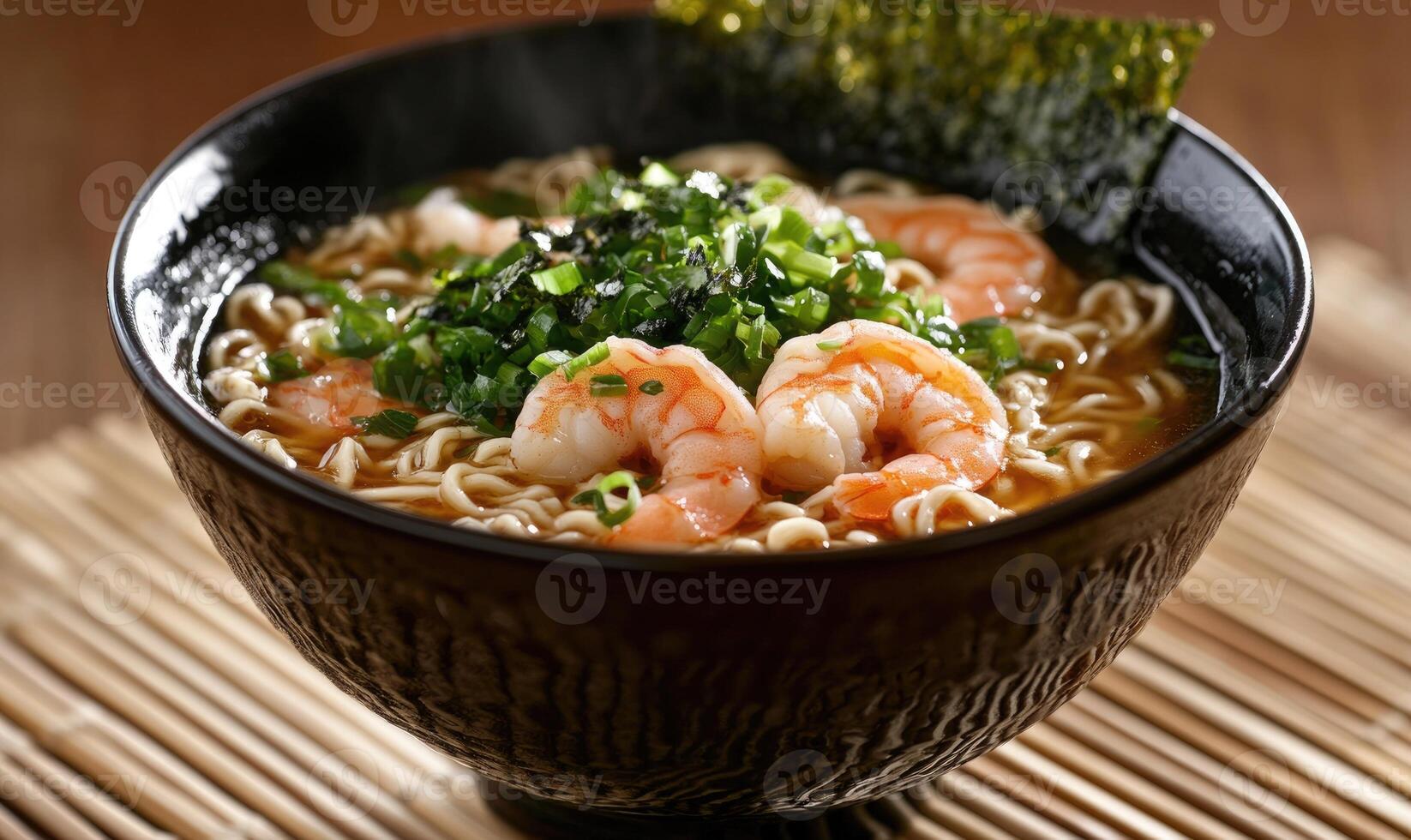 A bowl of ramen soup with shrimp and green vegetables photo