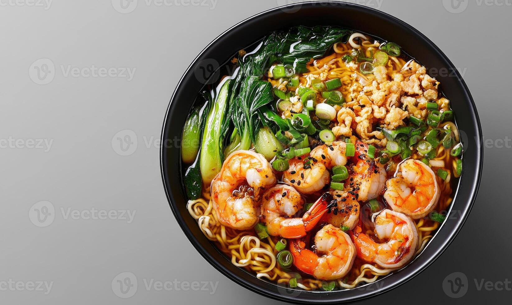 A bowl of shrimp and vegetables with noodles photo