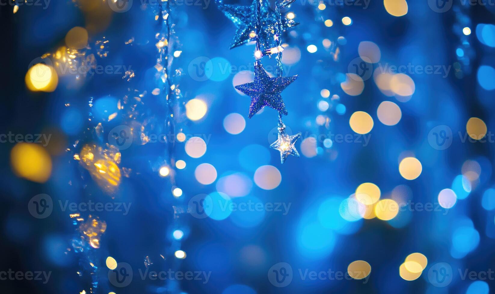 A blue and yellow star is hanging from a blue and yellow string photo