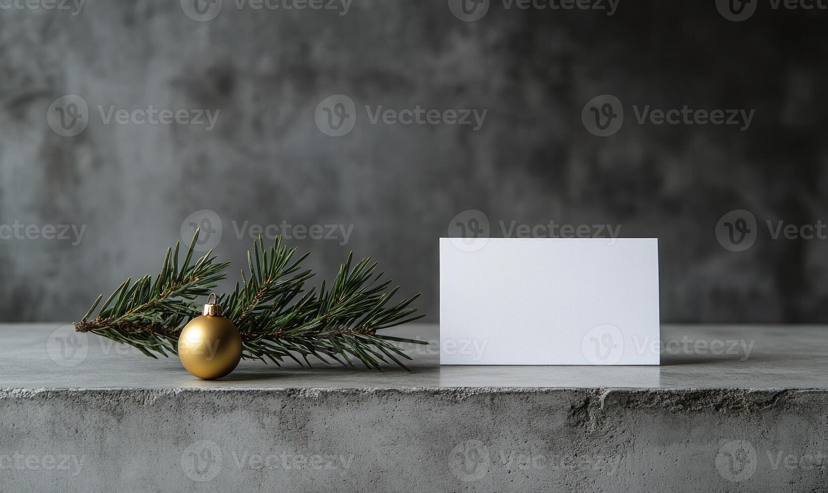A white card with a gold ornament on top of it photo
