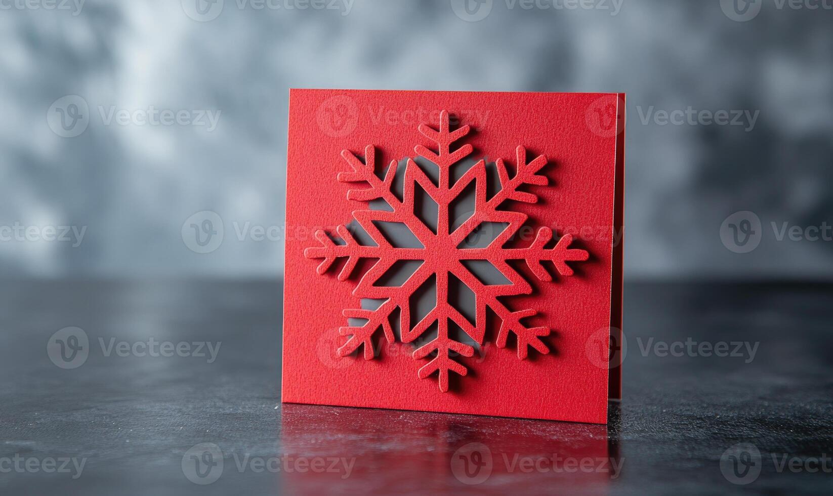 A red card with a snowflake design on it photo