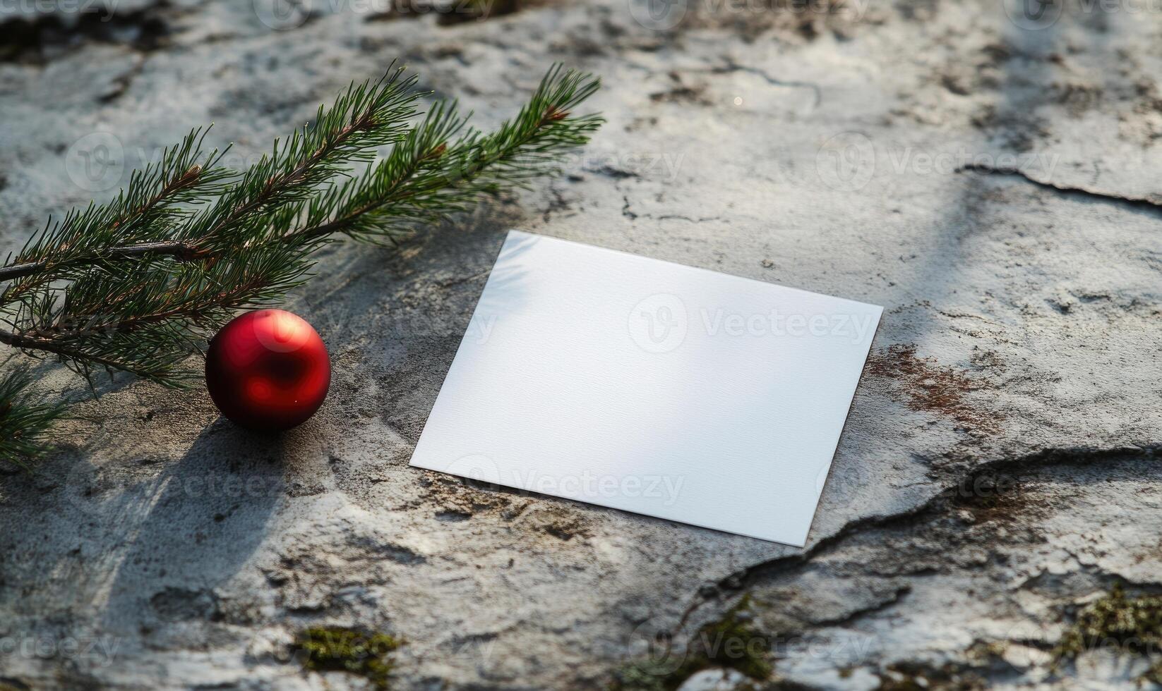 A white card with a red ball on top of it photo