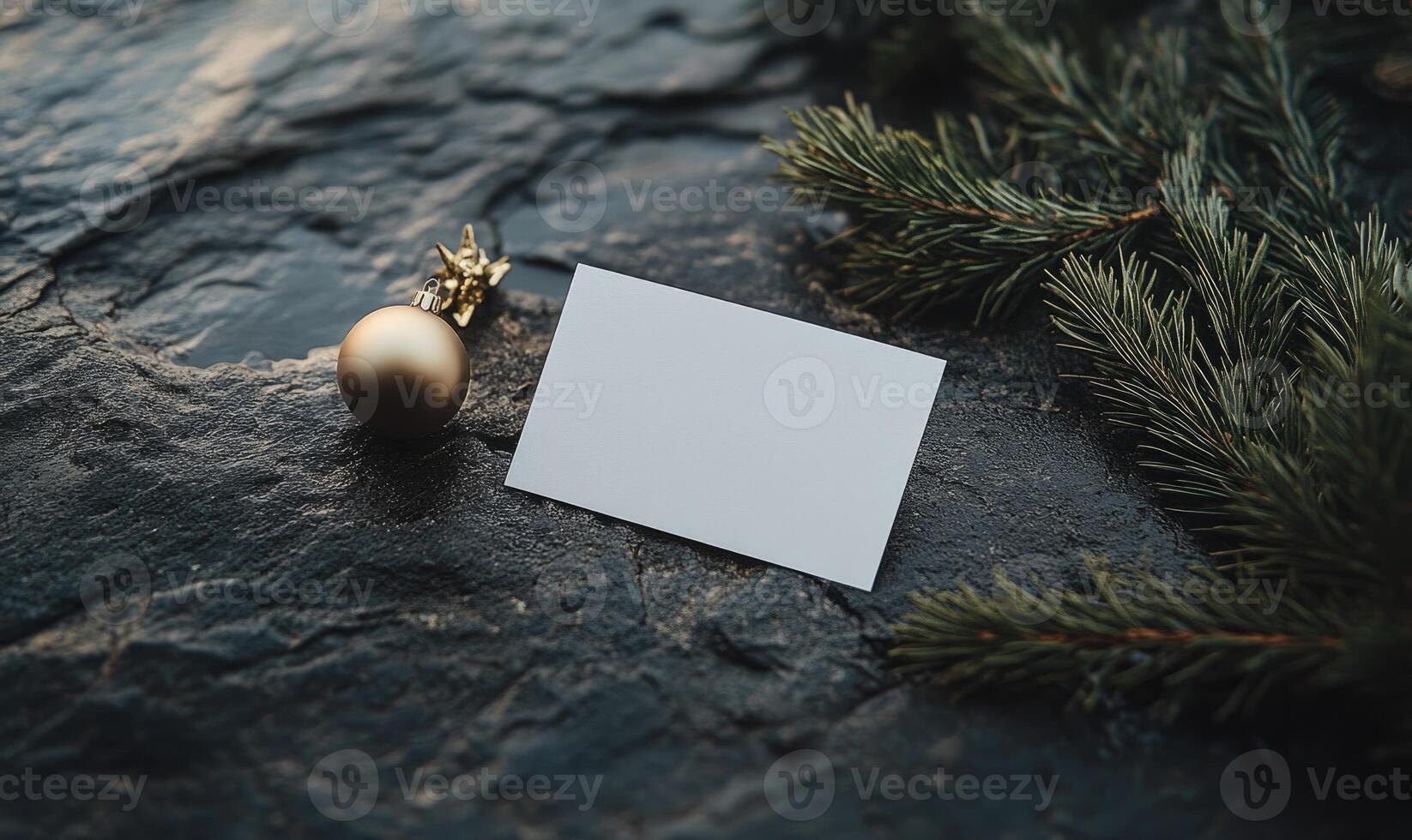 A white card with a gold ornament on top of it photo